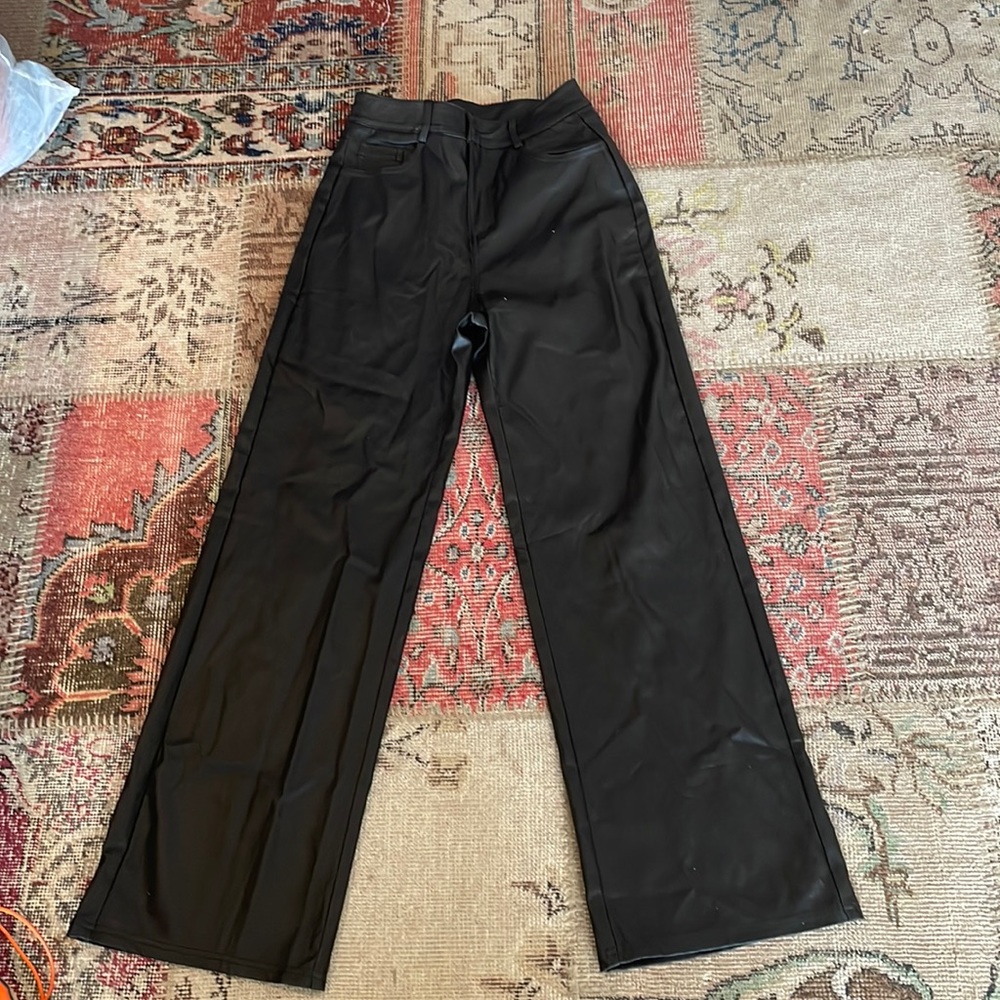 These are black leather pants. Size-27